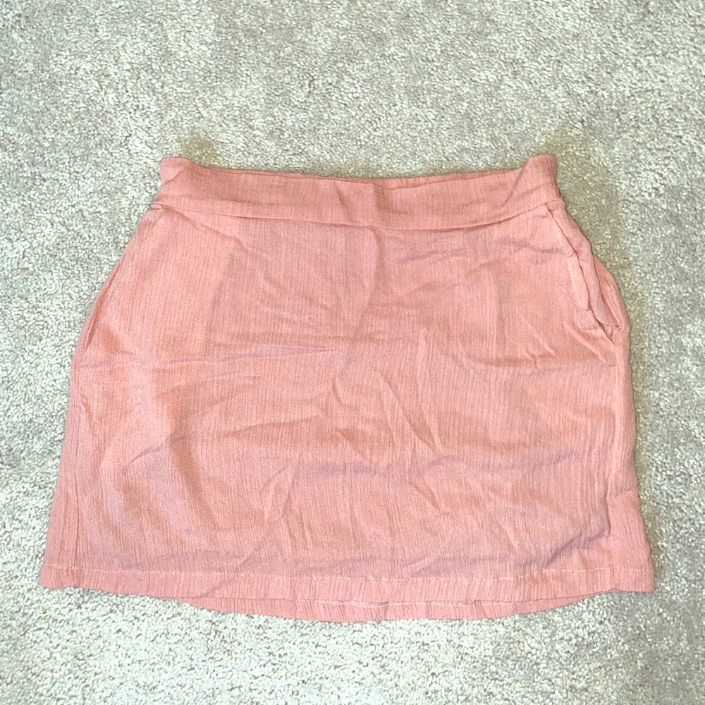 Blush mini skirt with side pockets